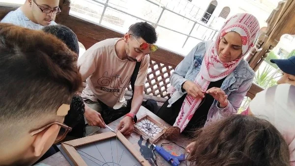 ورشة فنية مبدعة بالمتحف القبطي تحتفي برأس السنة الهجرية برموز الغار والحمامة والعنكبوت